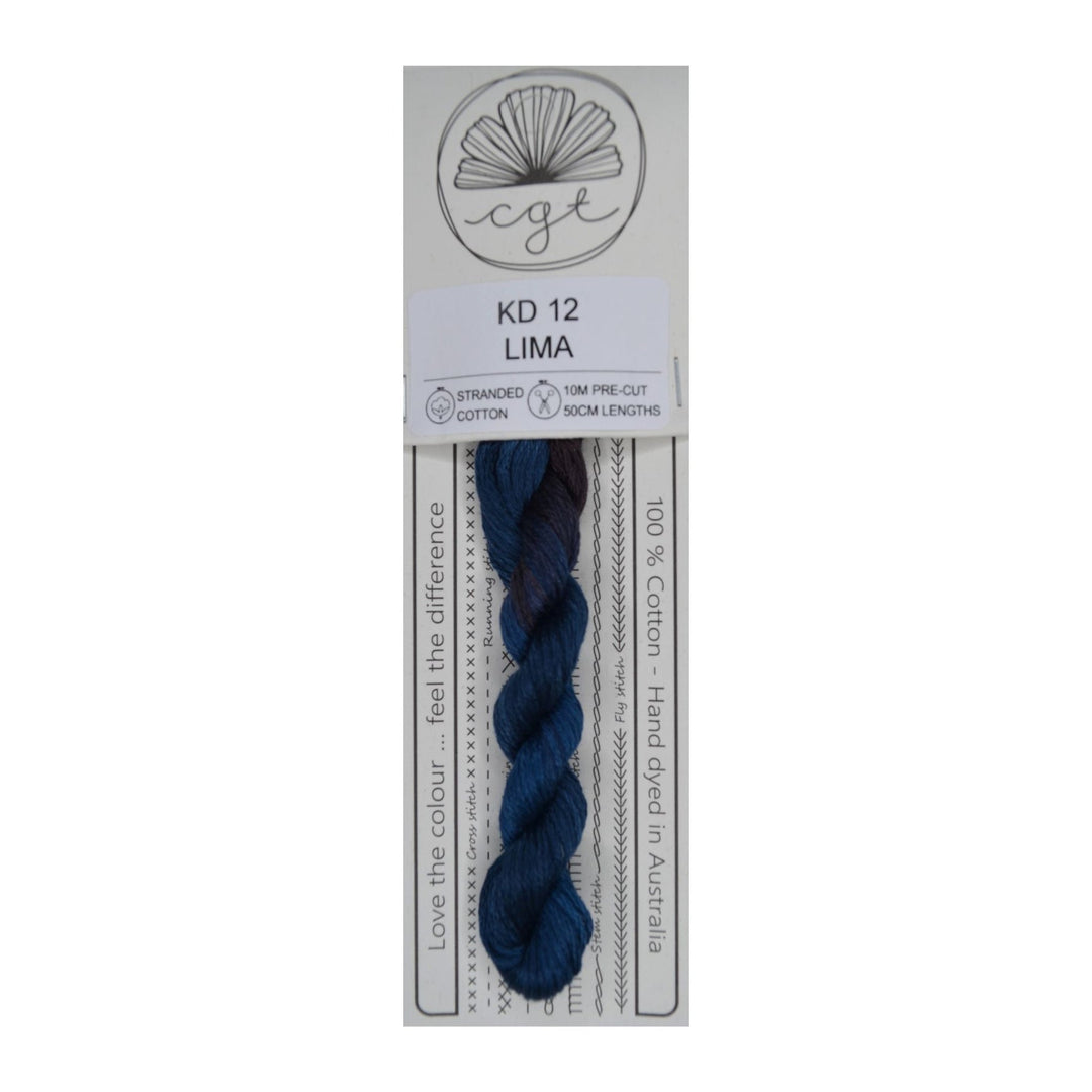 Packaged skein of dark blue thread with a label on a white background