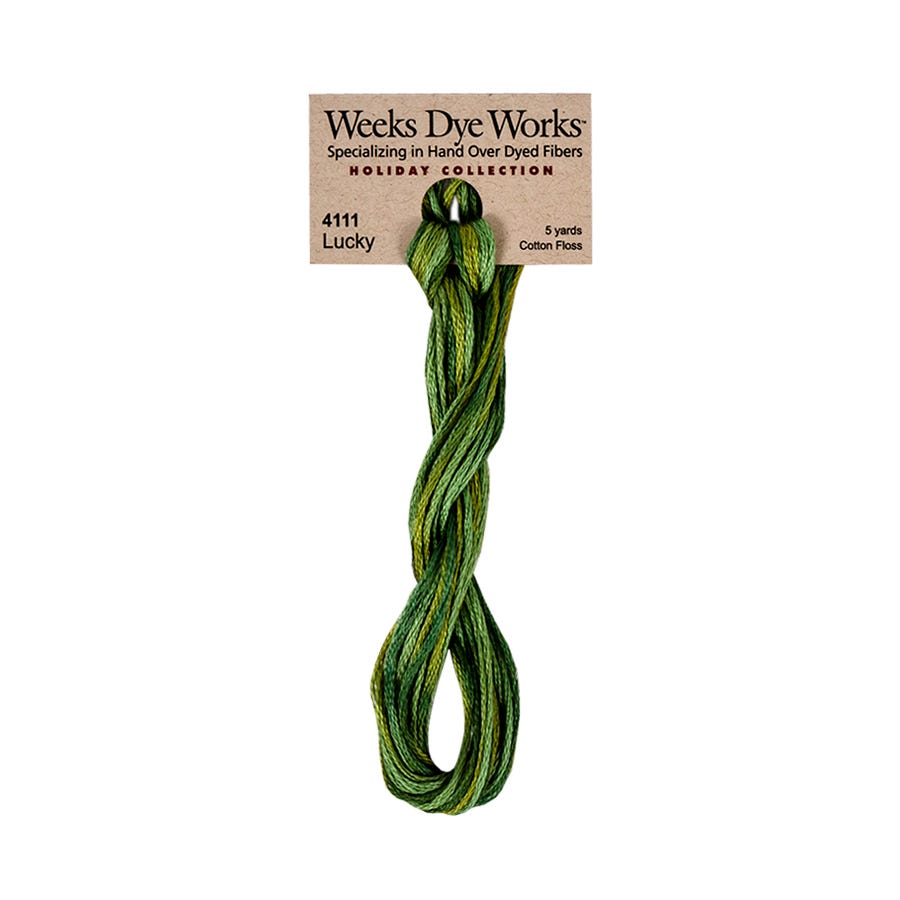 Green skein of Weeks Dye Works embroidery floss on a white background