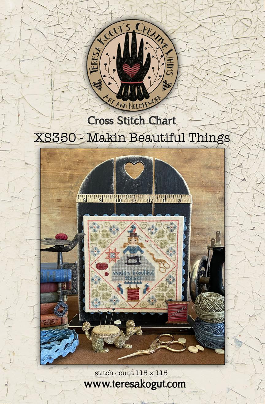 Cross stitch chart packaging with a wooden frame and yarn on a textured beige background