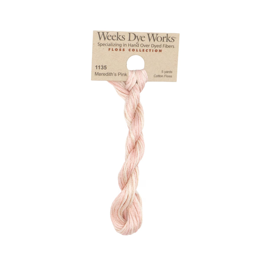 A single skein of Weeks Dye Works cotton thread in shade 1135 Meredith's Pink, attached to its original kraft paper header card, shown against a plain white background.