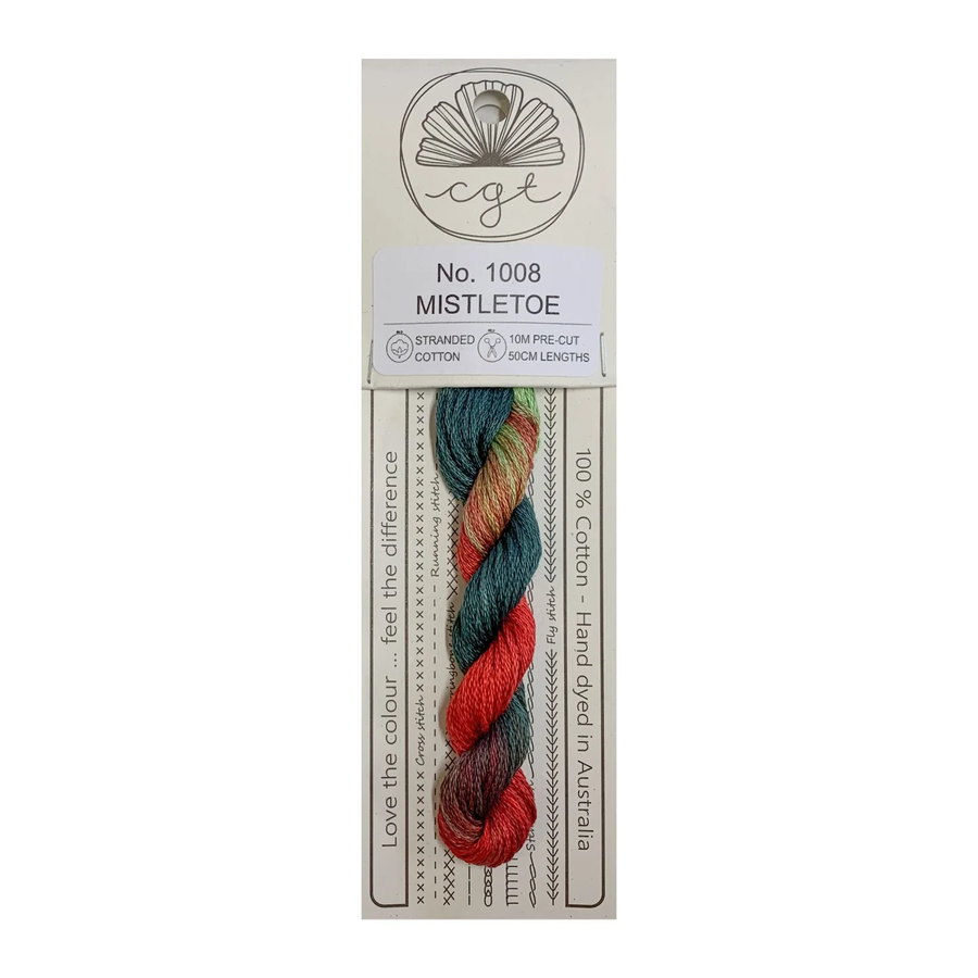 A skein of hand-dyed cotton cross stitch and embroidery floss in red, green, and blue colors, labeled 'Mistletoe' from Cottage Garden Threads.