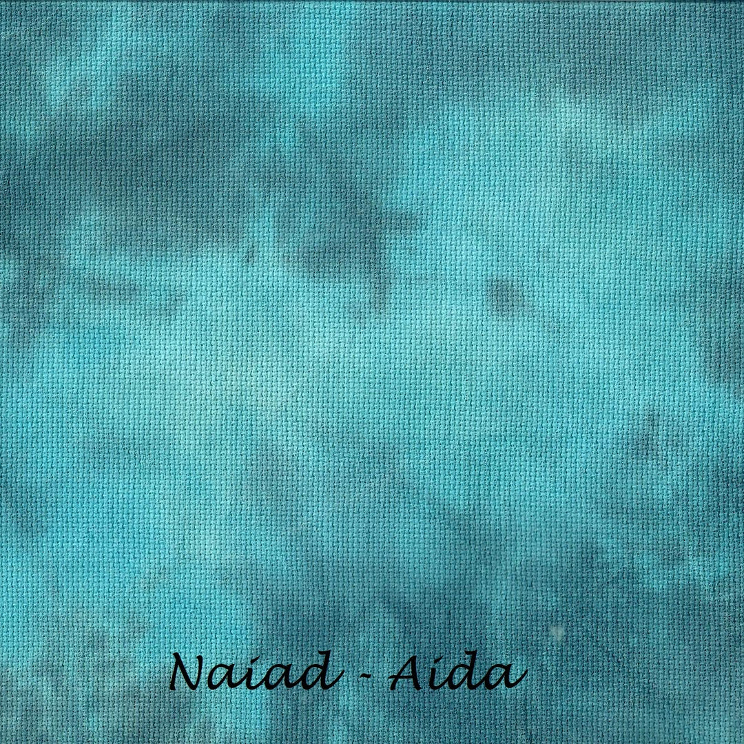 A square fabric swatch with a mottled turquoise, teal, and blue textured pattern, featuring the text 'Naiad - Aida' printed in black at the bottom.