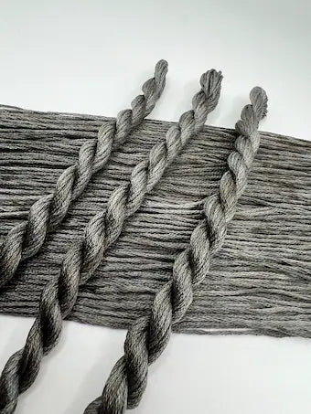 Gray braided yarn on a white background