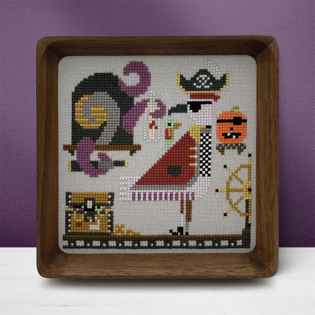Cross-stitched design of a character with a wooden frame on a purple background