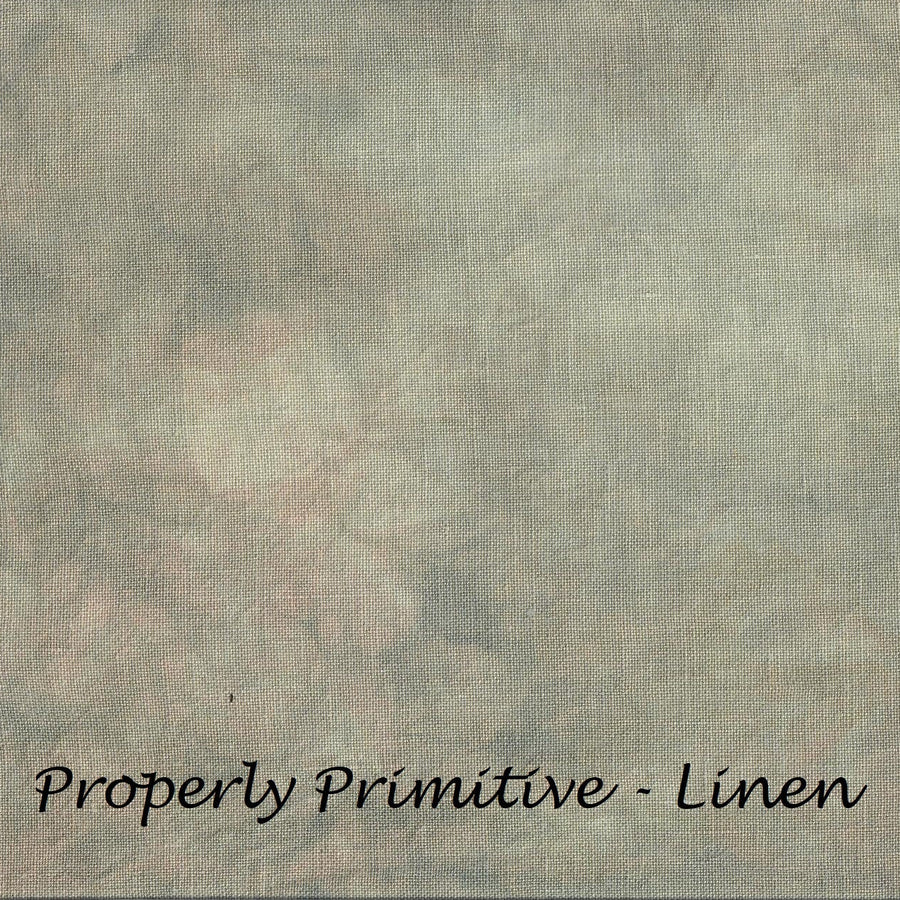 A close-up of a linen fabric texture in muted beige, gray, and soft pink tones, with the text 'Properly Primitive - Linen' printed at the bottom.
