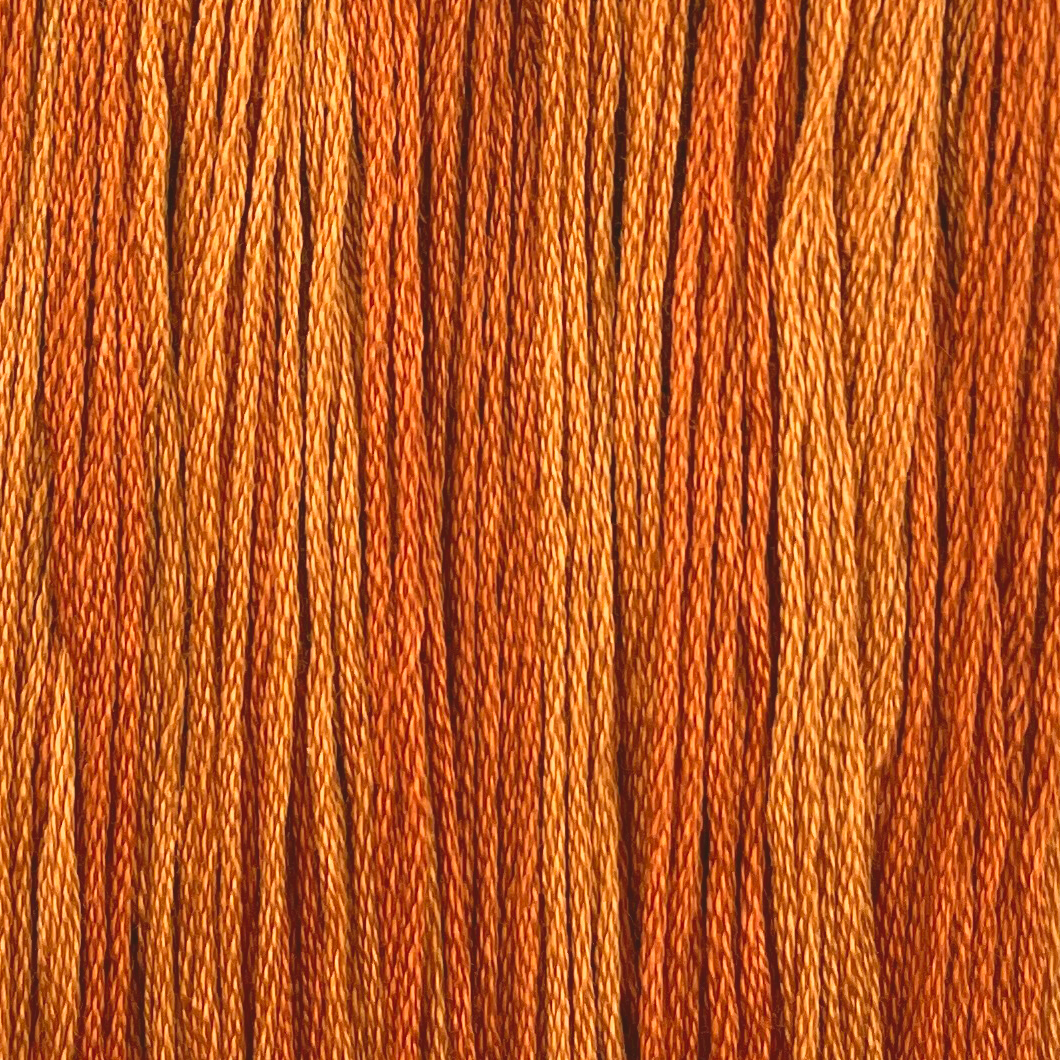 this lightly variegated orange thread is a handdyed color from colour and cotton perfect for any autumn project