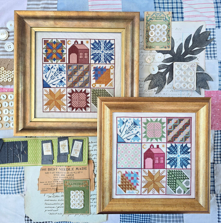 Two framed cross-stitch patterns on a fabric background with buttons and fabric swatches.