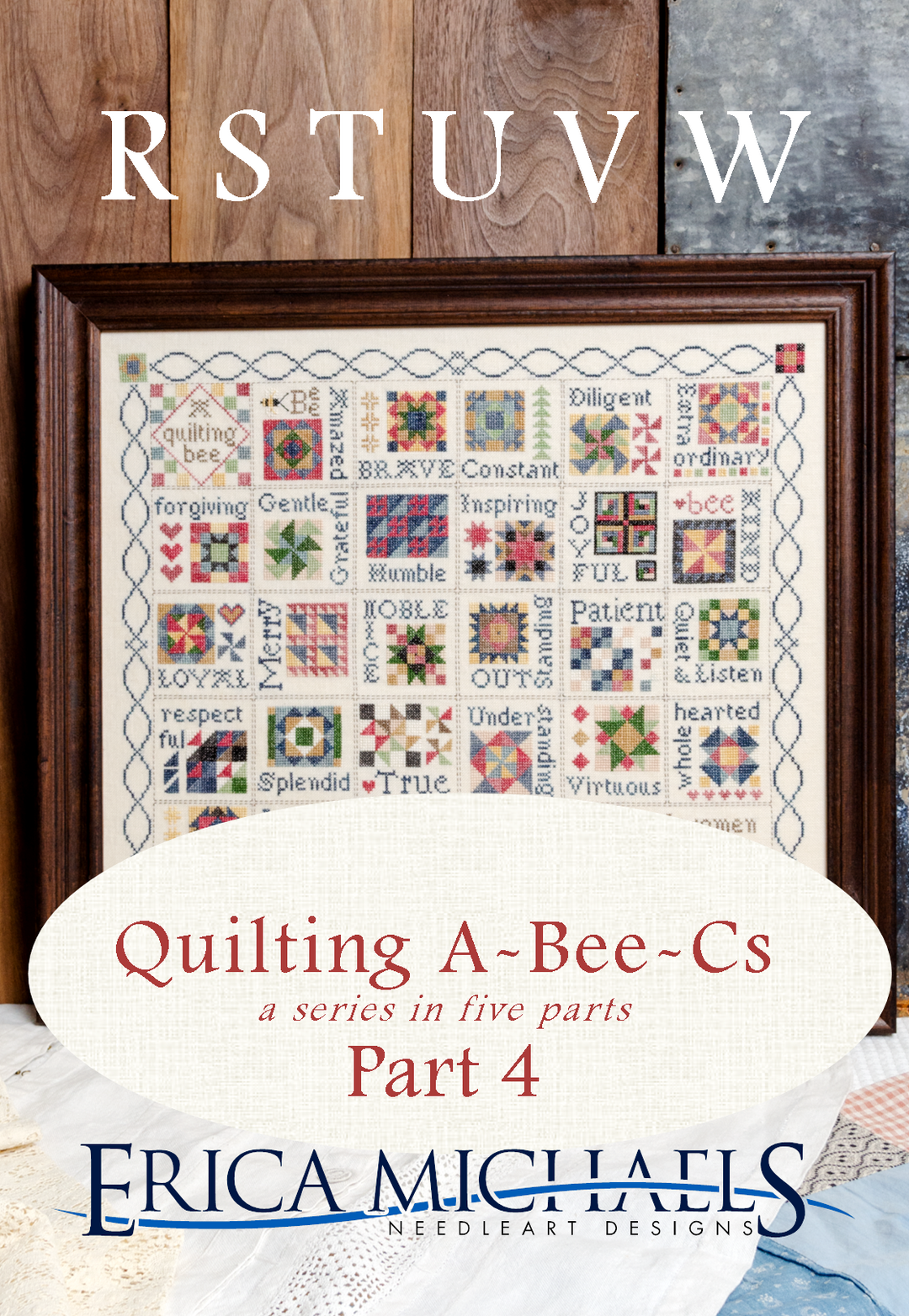 Quilt with embroidered text and wooden frame, featuring the title 'Quilting A-Bee-Cs' by Erica Michaels.