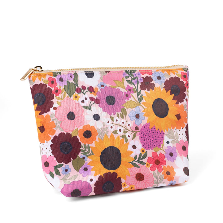 zipper pouich with colorful floral pattern in pinks orange yellow