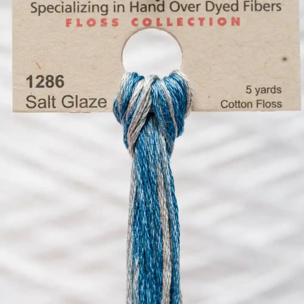 Blue and gray floss collection with a label on a white background