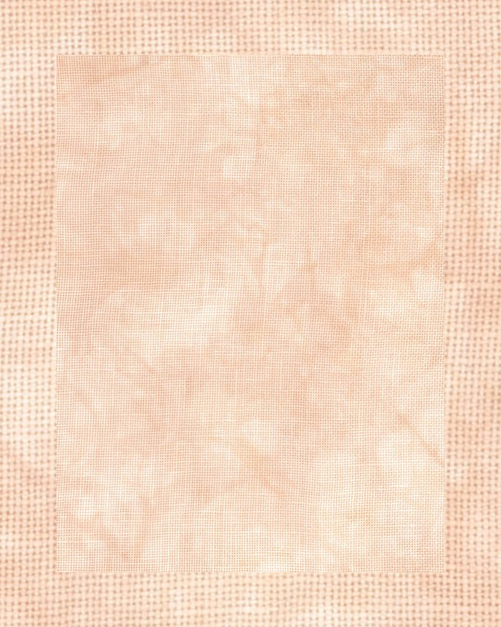 A square fabric swatch with a mottled, marbled pattern in light peach, beige, and soft pink tones, framed by a textured dotted border.