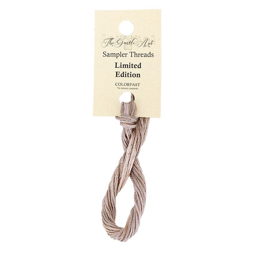 Sampler threads with a label on a white background