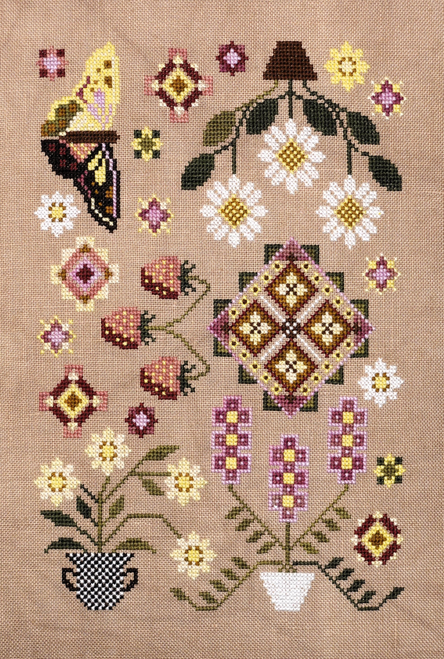 Cross-stitched pattern with flowers, butterflies, and geometric shapes on a beige background
