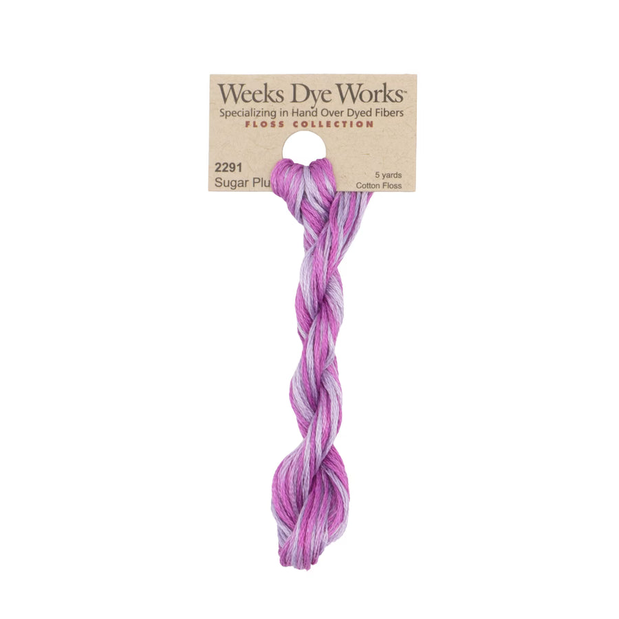 A twisted skein of Weeks Dye Works 'Floss Collection' cotton floss in the shade 'Sugar Plum', featuring a variegated pattern of purple, pink, and lavender.
