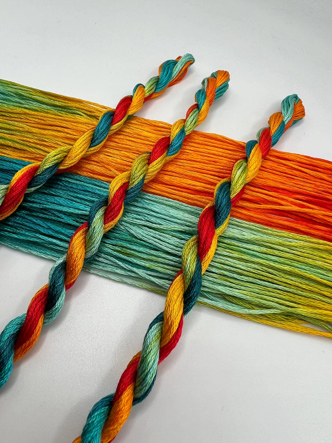 Colorful braided yarn on a white background
