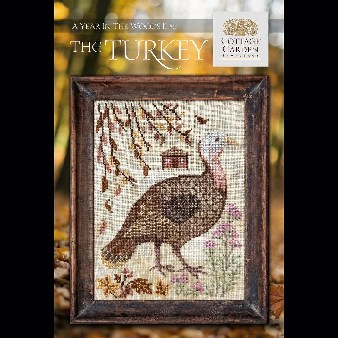 Cross-stitched turkey design with a wooden frame, featuring the Cottage Garden brand.