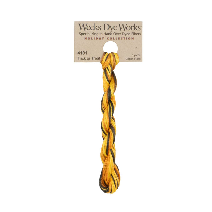 A single twisted cotton cord in a mustard yellow and black striped pattern, attached to a paper header card that reads 'Weeks Dye Works Holiday Collection 4101 Trick or Treat.' on a plain white background.