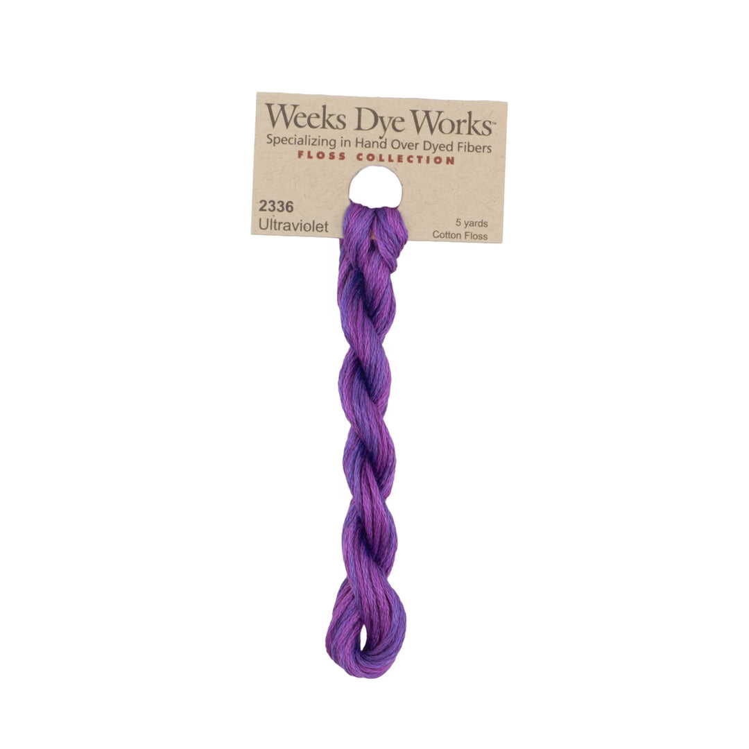A single twisted bundle of Weeks Dye Works cotton floss in the shade Ultraviolet, attached to a kraft paper header card, shown against a plain white background.