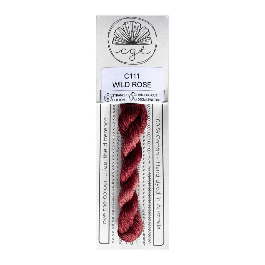 Red thread skein in a packaging labeled 'Wild Rose' on a white background