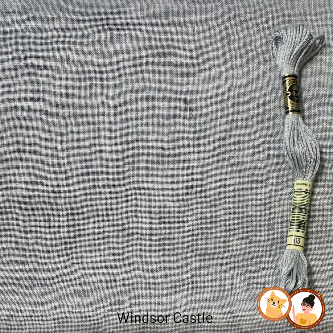 A close-up of a gray woven fabric texture with a skein of matching gray embroidery floss placed on the right side. The text 'Windsor Castle' appears at the bottom, and a logo is near the lower right corner.