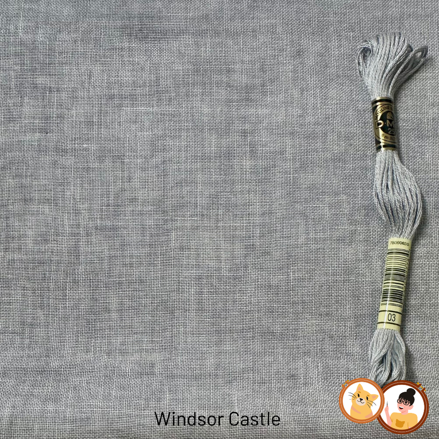 A close-up of a gray woven fabric texture with a skein of matching gray embroidery floss placed on the right side. The text 'Windsor Castle' appears at the bottom, and a logo is near the lower right corner.
