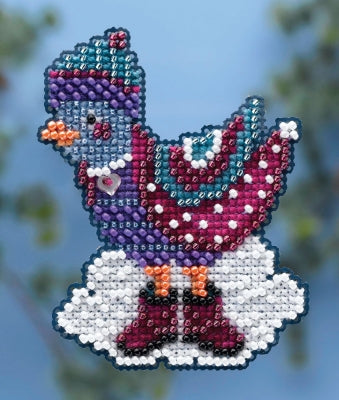 Colorful beaded bunny ornament against a blurred natural background