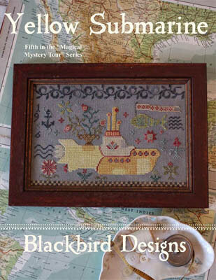 Cross-stitched yellow submarine design on a map background with 'Blackbird Designs' branding.