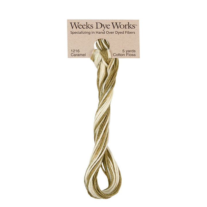 Weeks Dye Works hand-dyed cotton embroidery floss skein in caramel 1216, a gold green and cream variegated thread