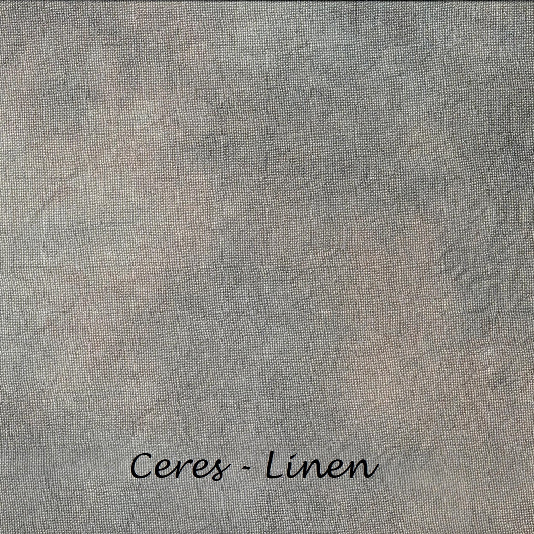 A textured fabric swatch with a mottled gray and beige linen-like pattern, labeled 'Ceres - Linen' at the bottom.