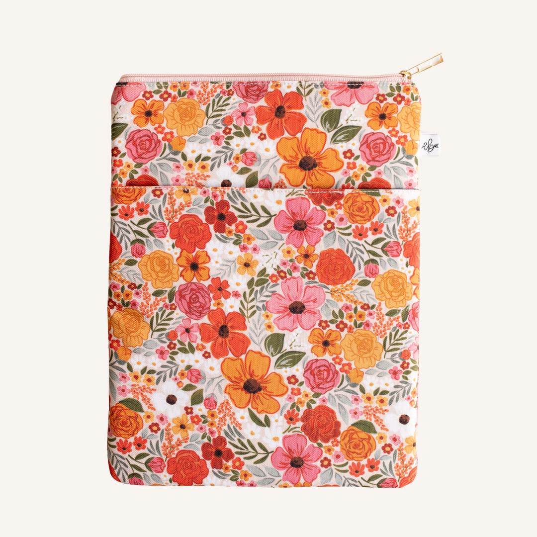 Floral-patterned pouch with a zipper on a white background