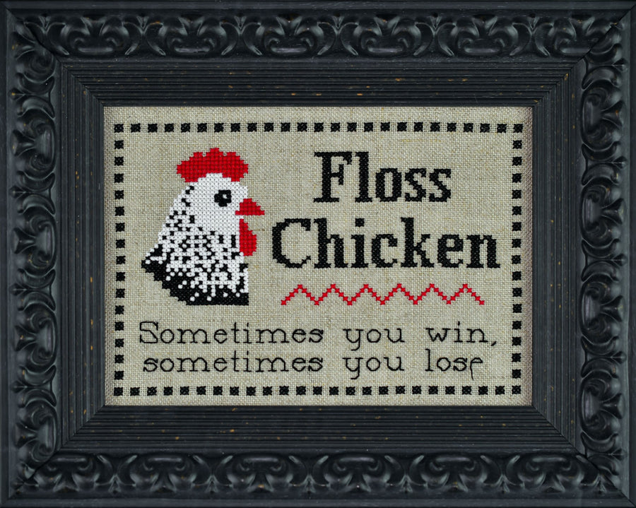 Cross-stitched design of a rooster with text 'Floss Chicken Sometimes you win, sometimes you lose' in a decorative frame.