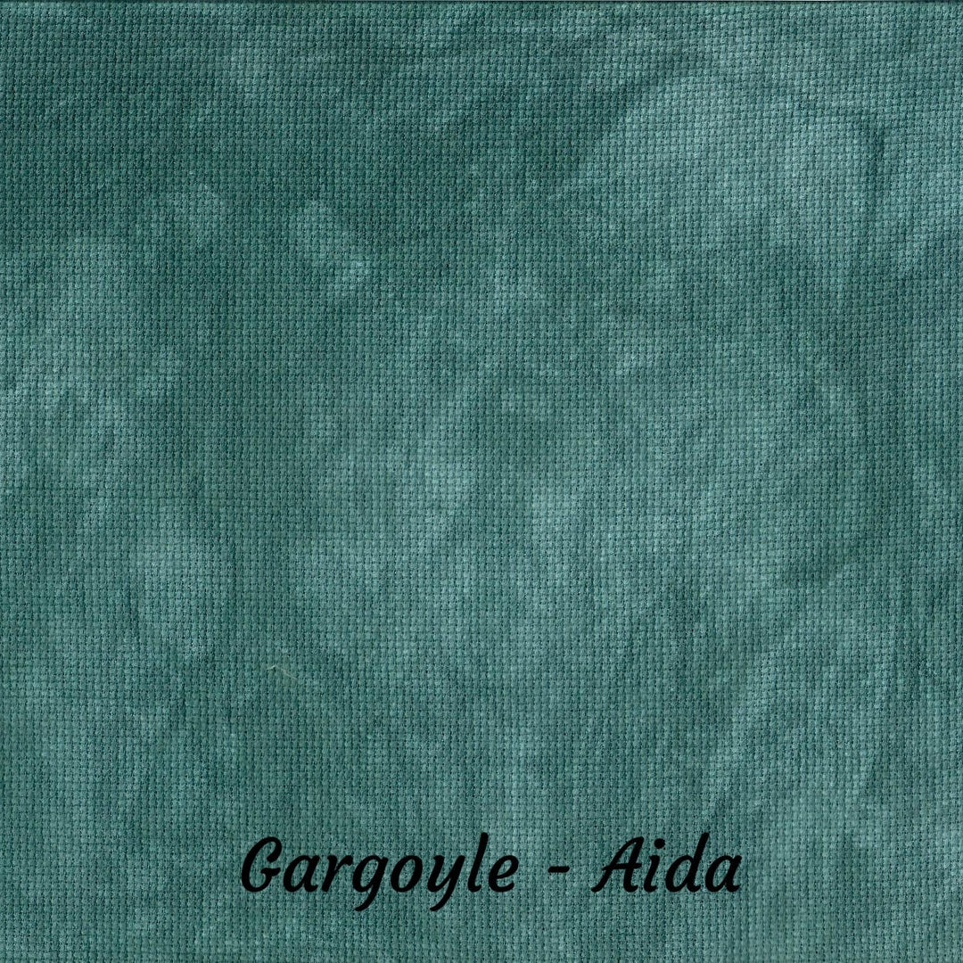 A close-up of a textured fabric swatch in a mottled teal-green color, labeled 'Gargoyle - Aida' at the bottom.