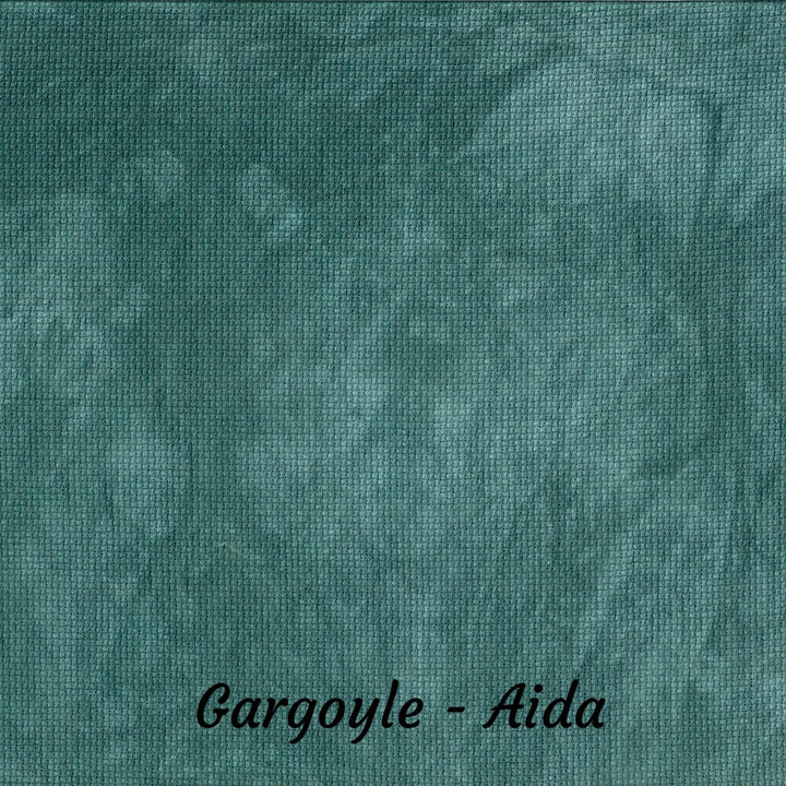 A close-up of a textured fabric swatch in a mottled teal-green color, labeled 'Gargoyle - Aida' at the bottom.