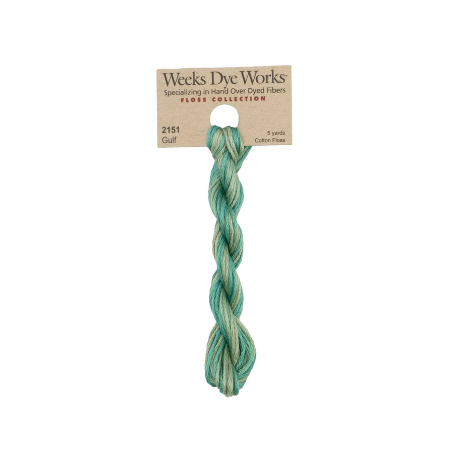 A single twisted bundle of Weeks Dye Works cotton thread in the shade 'Gulf' from their Floss Collection, attached to its original kraft paper label, on a solid white background.