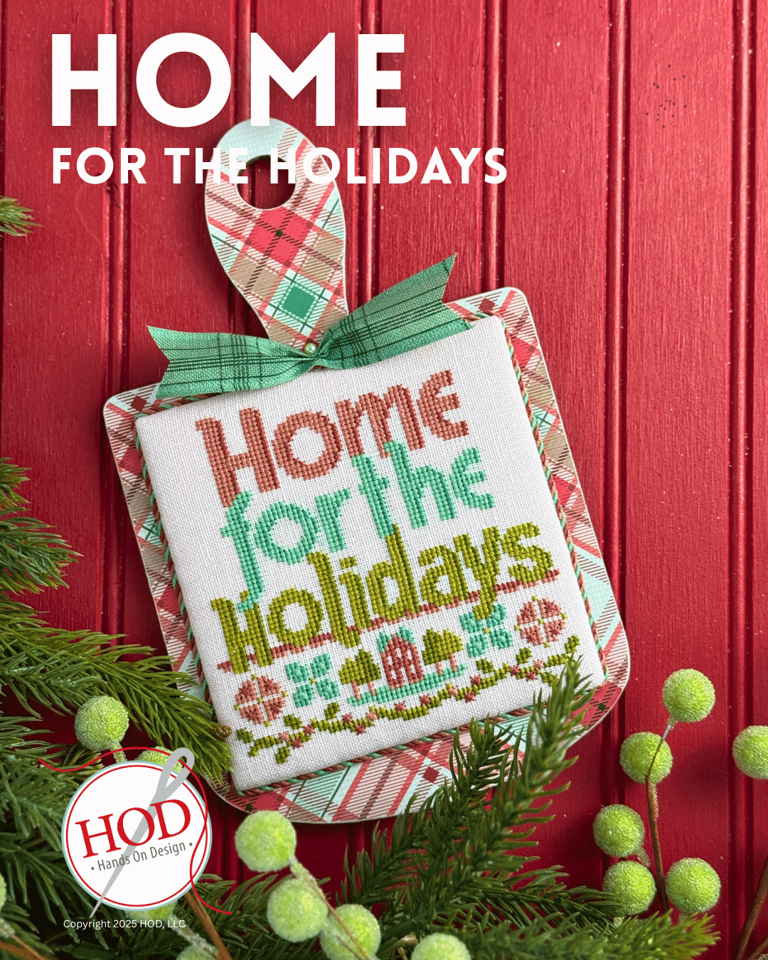 Decorative cross-stitch piece with 'Home for the Holidays' text on a red background
