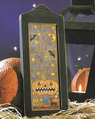 Decorative Halloween lantern with cross-stitched design featuring a pumpkin and text.