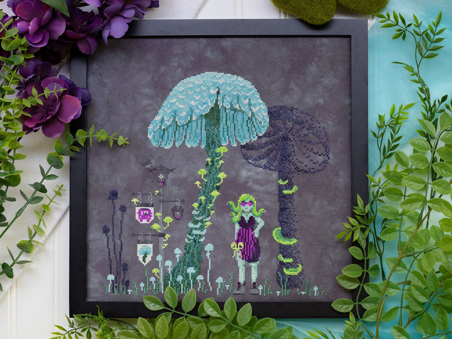 Framed artwork with a character under a blue umbrella surrounded by plants on a white background