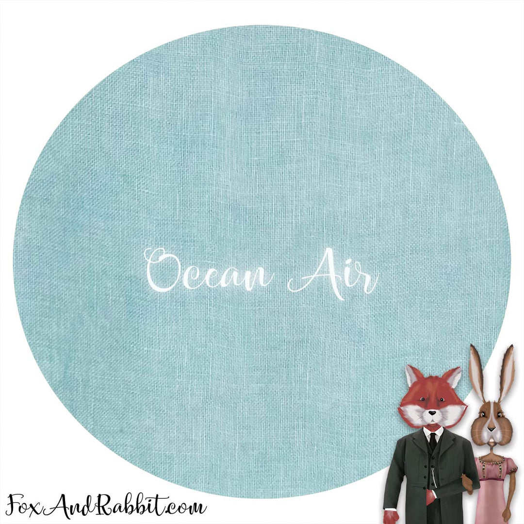 Illustration of a fox and rabbit couple in formal attire with 'Ocean Air' text on a blue circular background.