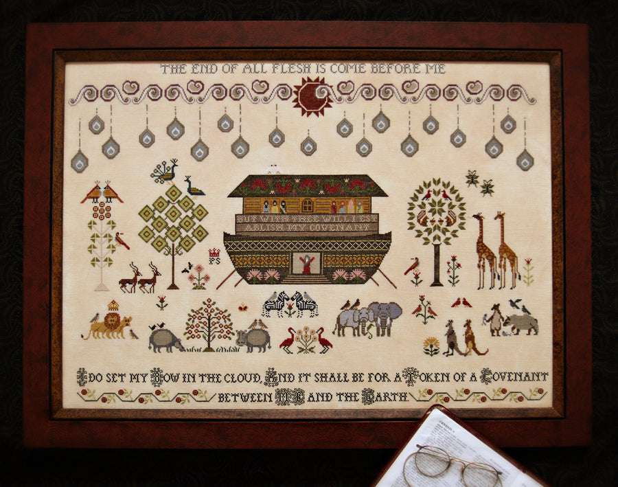 Decorative framed artwork with a Noah's Ark design and biblical text.