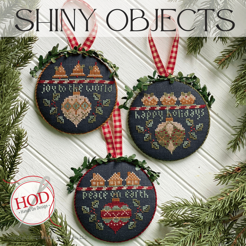 a trio of christmas ornaments featurign classic christmas motifs like ornaments, gingerbread, bells, and sweets. each ornament features a different short phrase like joy to the world, happy holidays, peace on earth