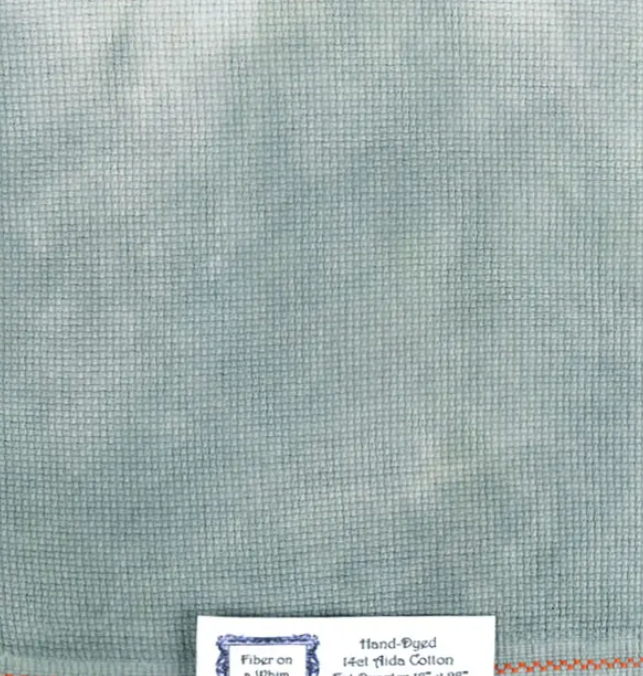 A swatch of hand-dyed fabric from Fiber on a Whim, showing a textured gray color.