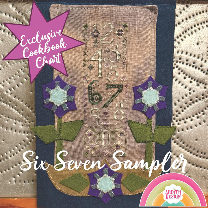 Embroidery design chart with flowers and numbers on a textured fabric background