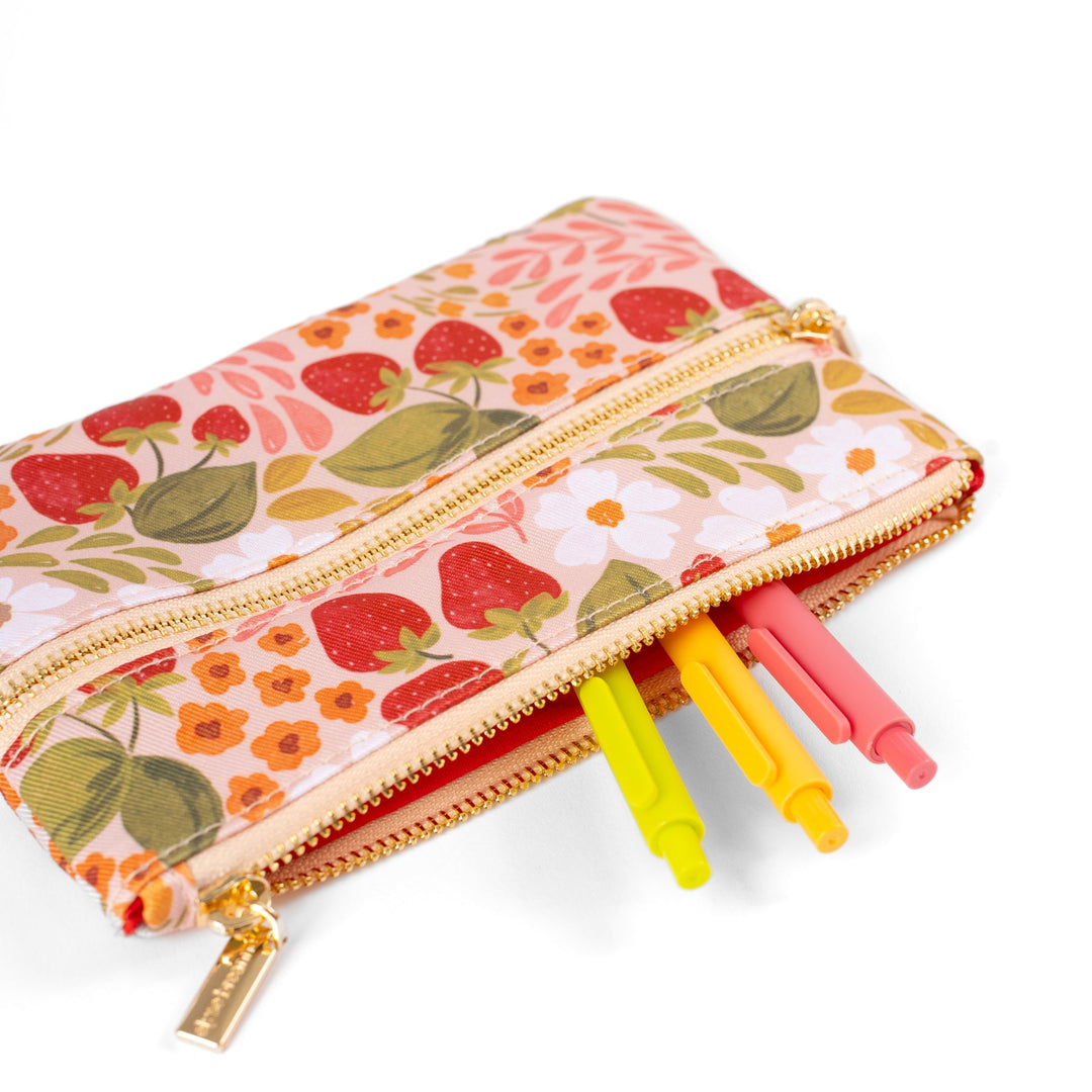 Floral-patterned pencil case with colorful markers on a white background