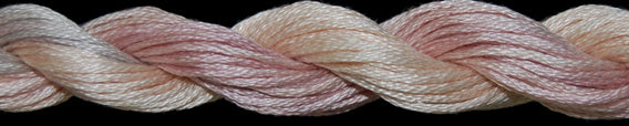 Close-up of braided yarn in pink and beige tones on a black background
