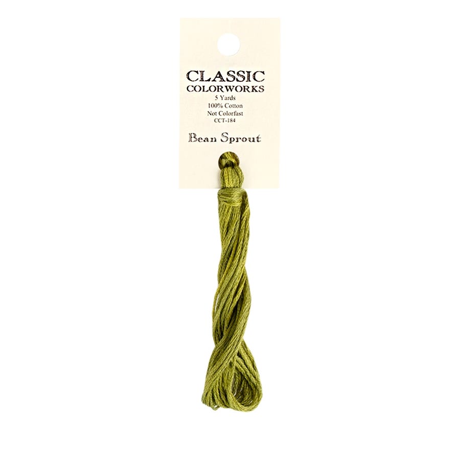 A skein of Classic Colorworks hand-dyed embroidery floss in a green color, labeled 'Bean Sprout'.