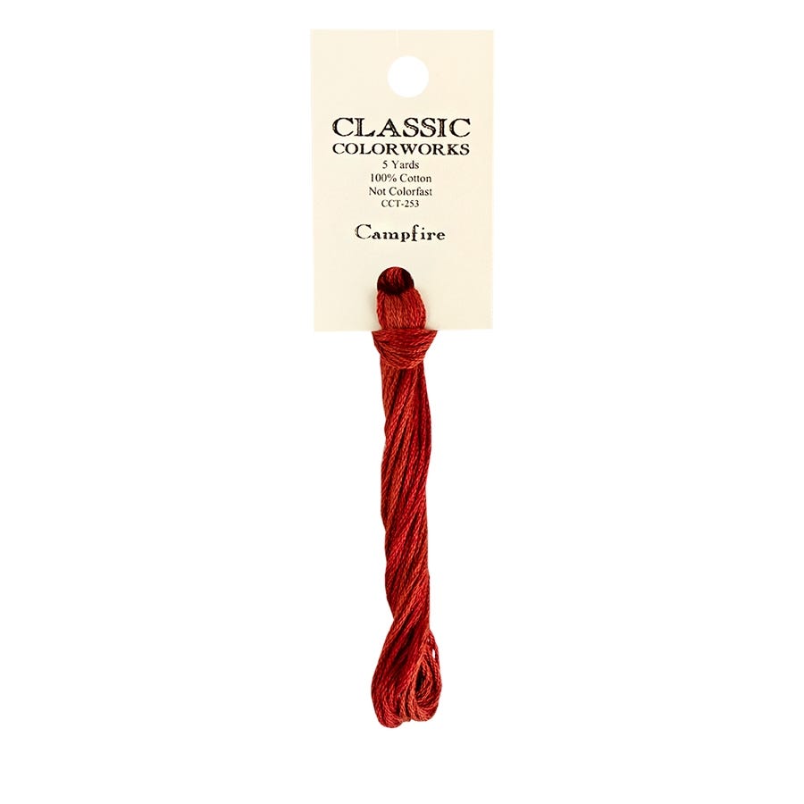 A skein of hand-dyed embroidery floss labeled 'Campfire' by Classic Colorworks, in a red color.
