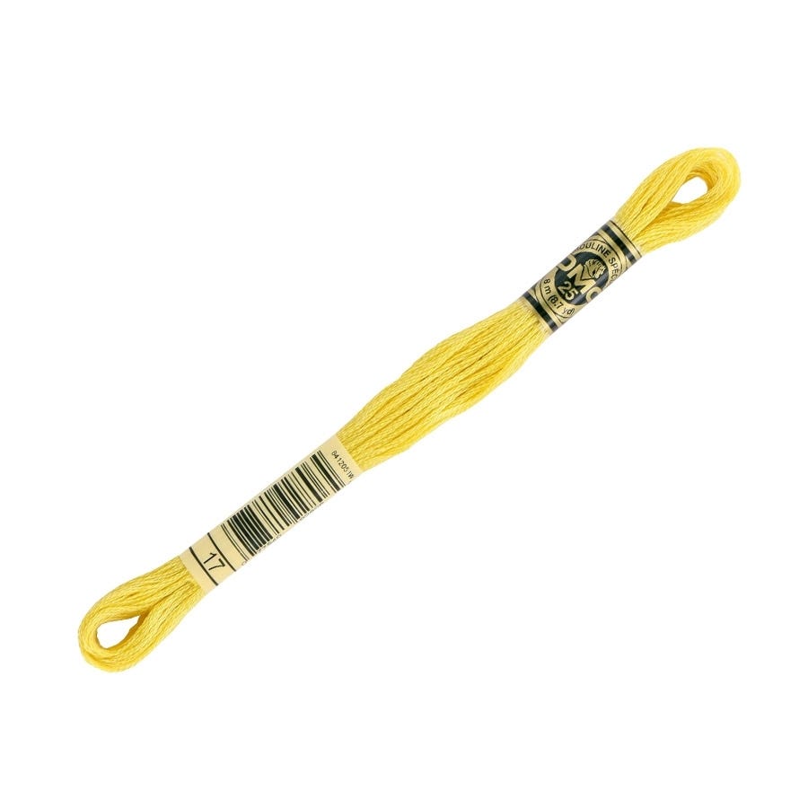 Yellow embroidery floss spool with a brand label on a white background