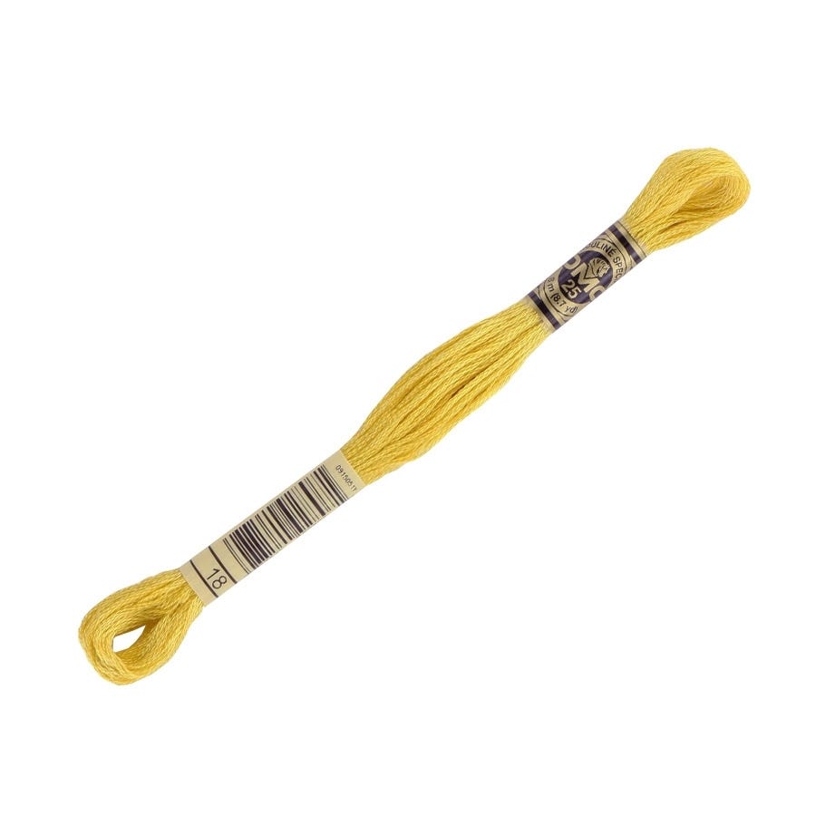Yellow embroidery floss on a white background