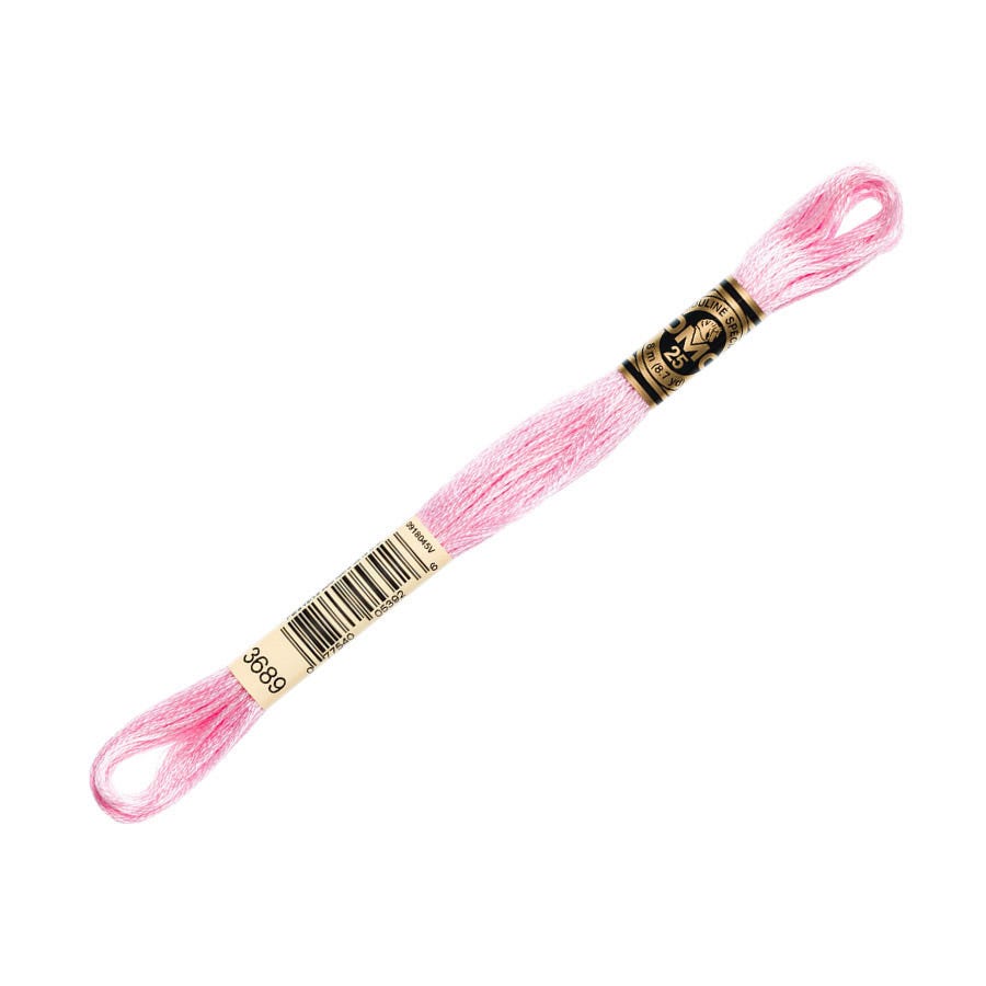 Pink embroidery floss spool with a gold label on a white background