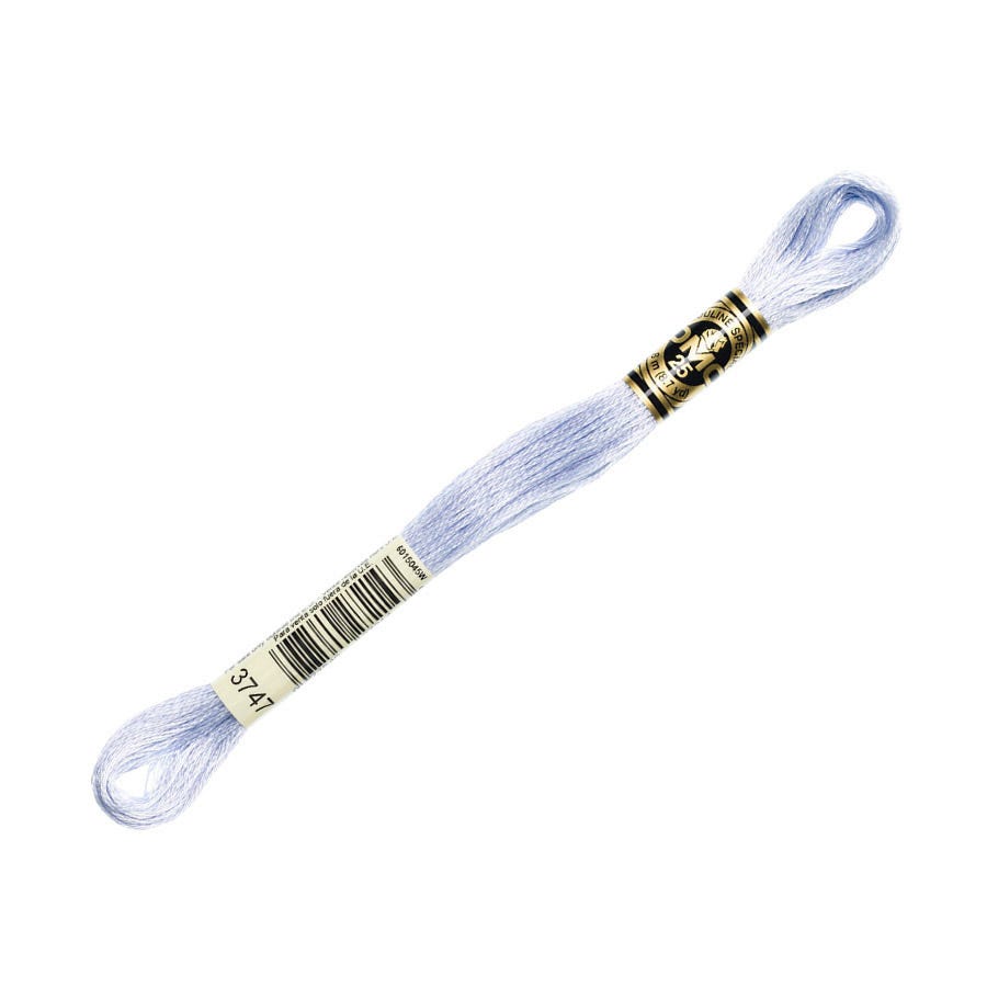 Embroidery floss spool with a gold and silver clasp on a white background